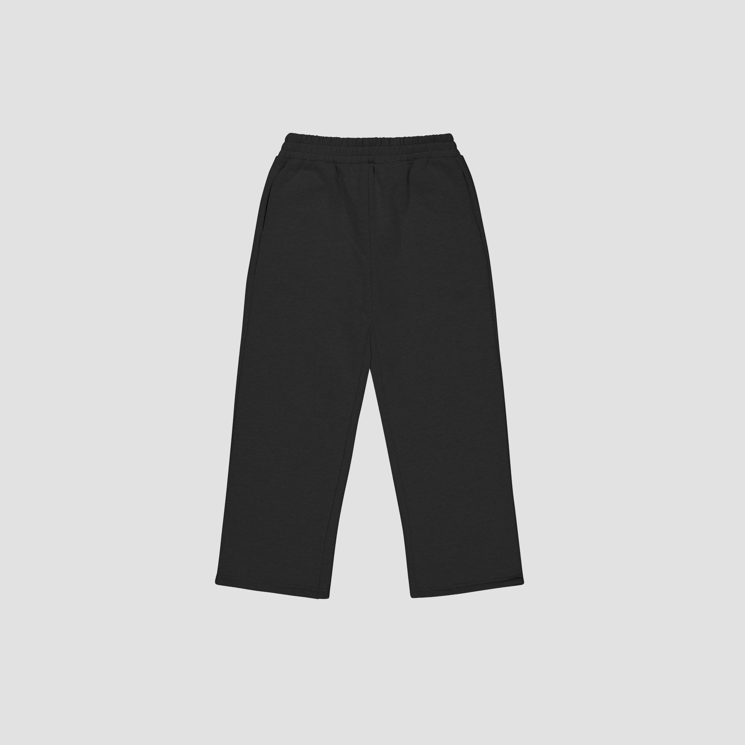 flat lay of Black track pants on a light gray background
