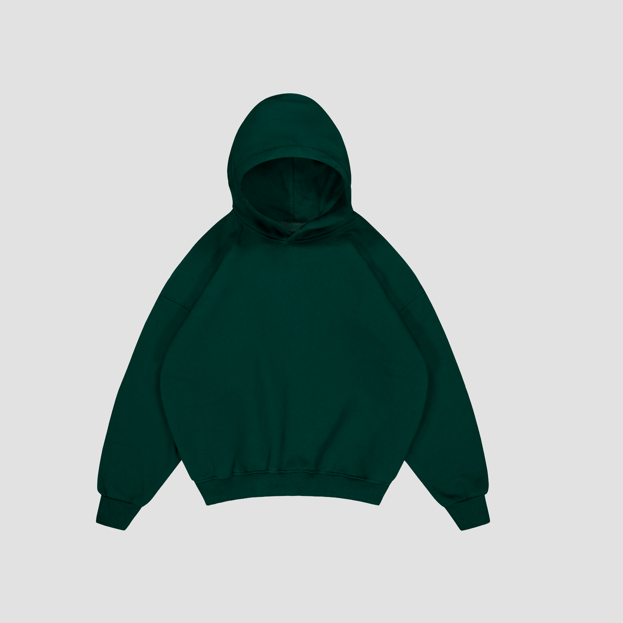 Flay lay of British Racing Green hoodie on a light gray background