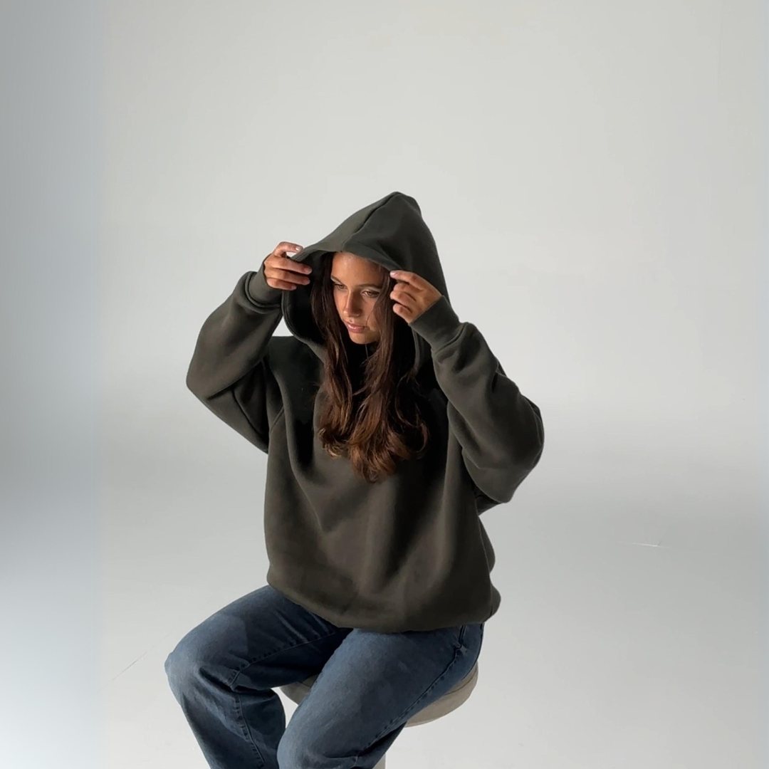 Woman wearing deepgreen heavy weight hoodie