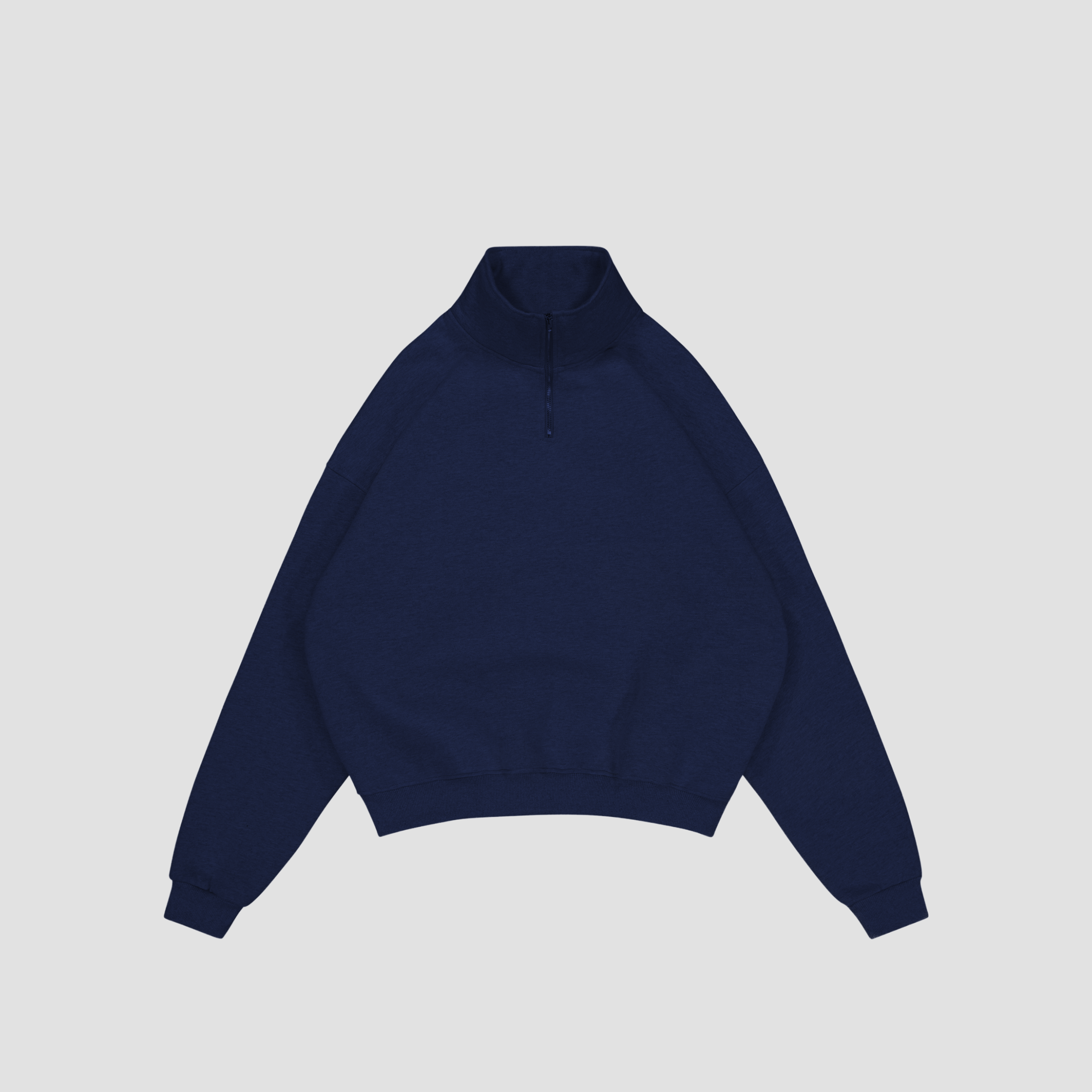 Flay lay of Navy blue quarter-zip sweatshirt on a light gray background