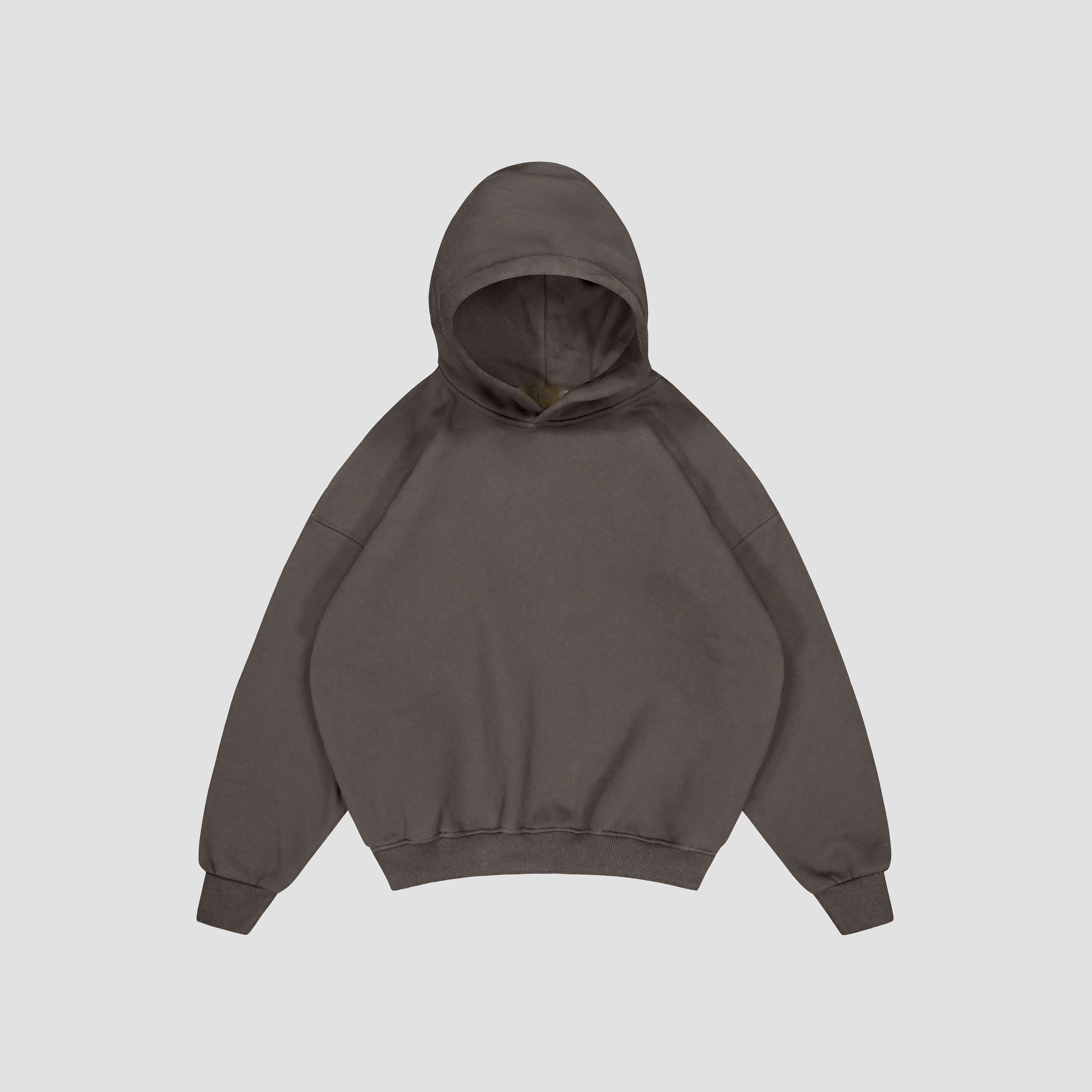 Flat lay of Shadow Grey hoodie on a light gray background
