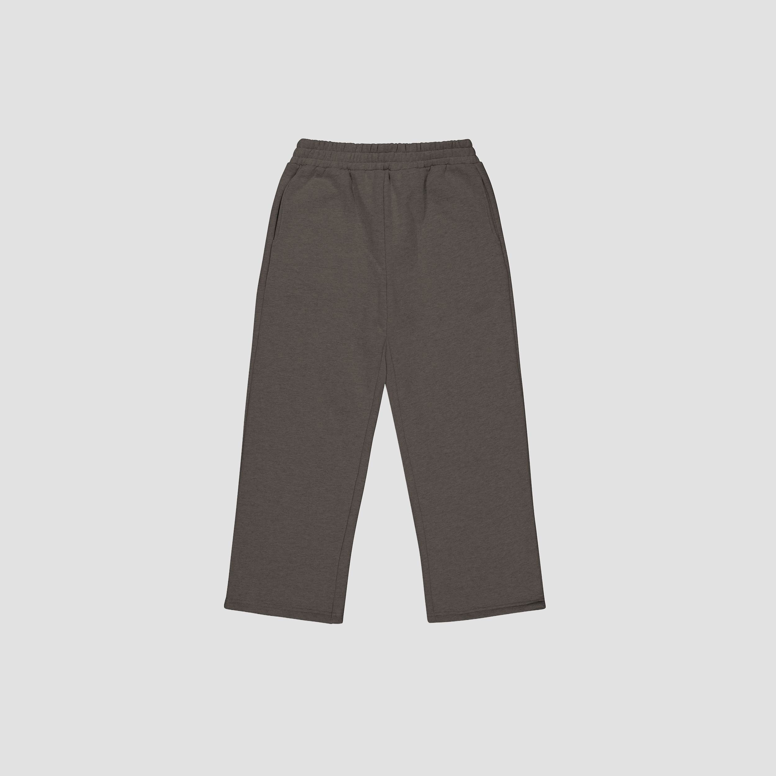 Flat lay of shadow gray track pants on a light gray background
