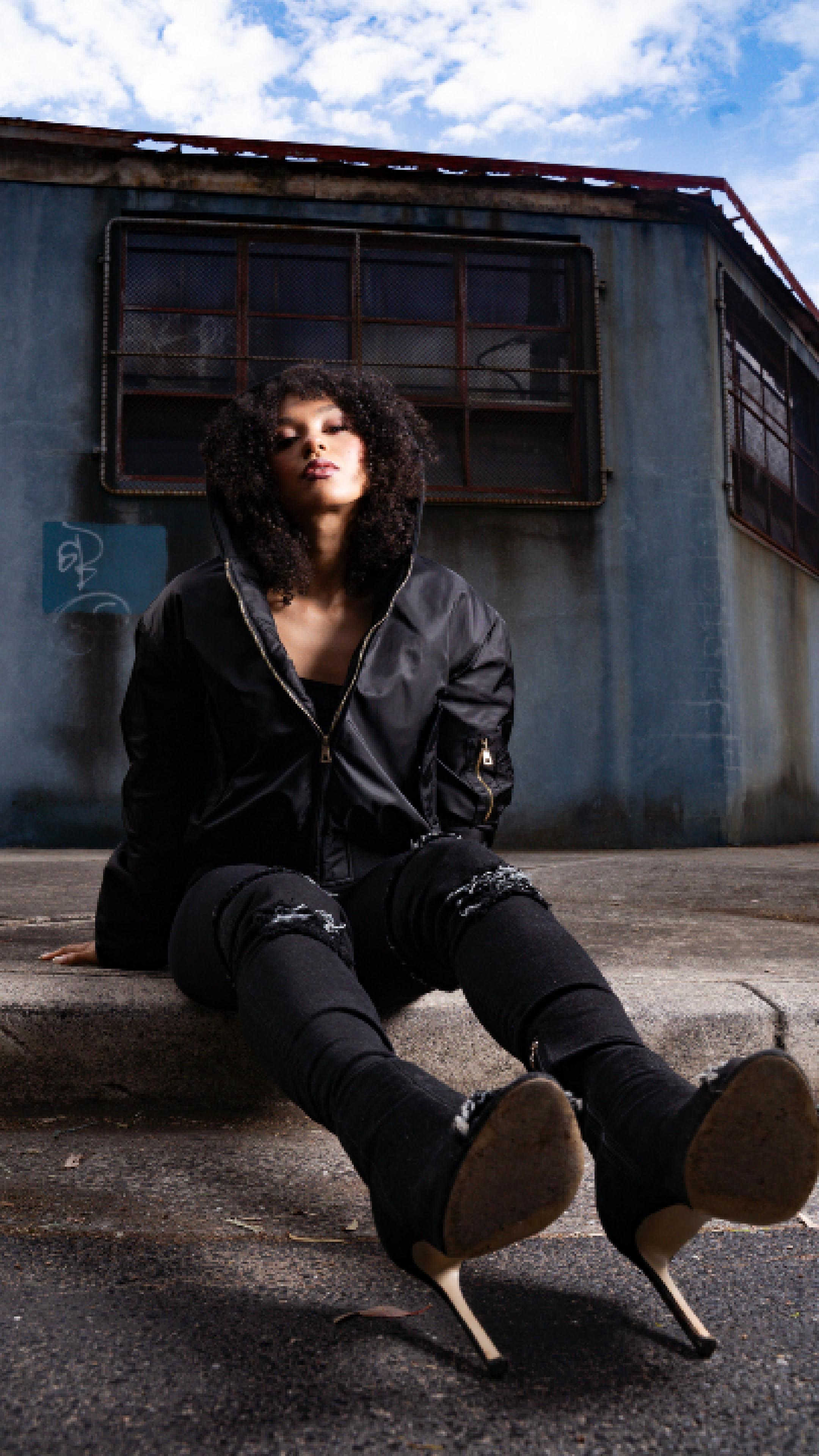 Woman wearing black bomber jacket