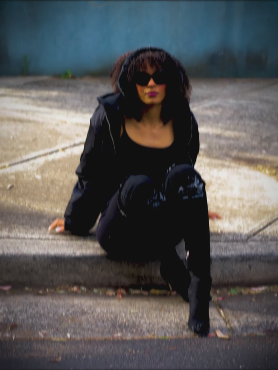 Woman wearing black bomber jacket with hood